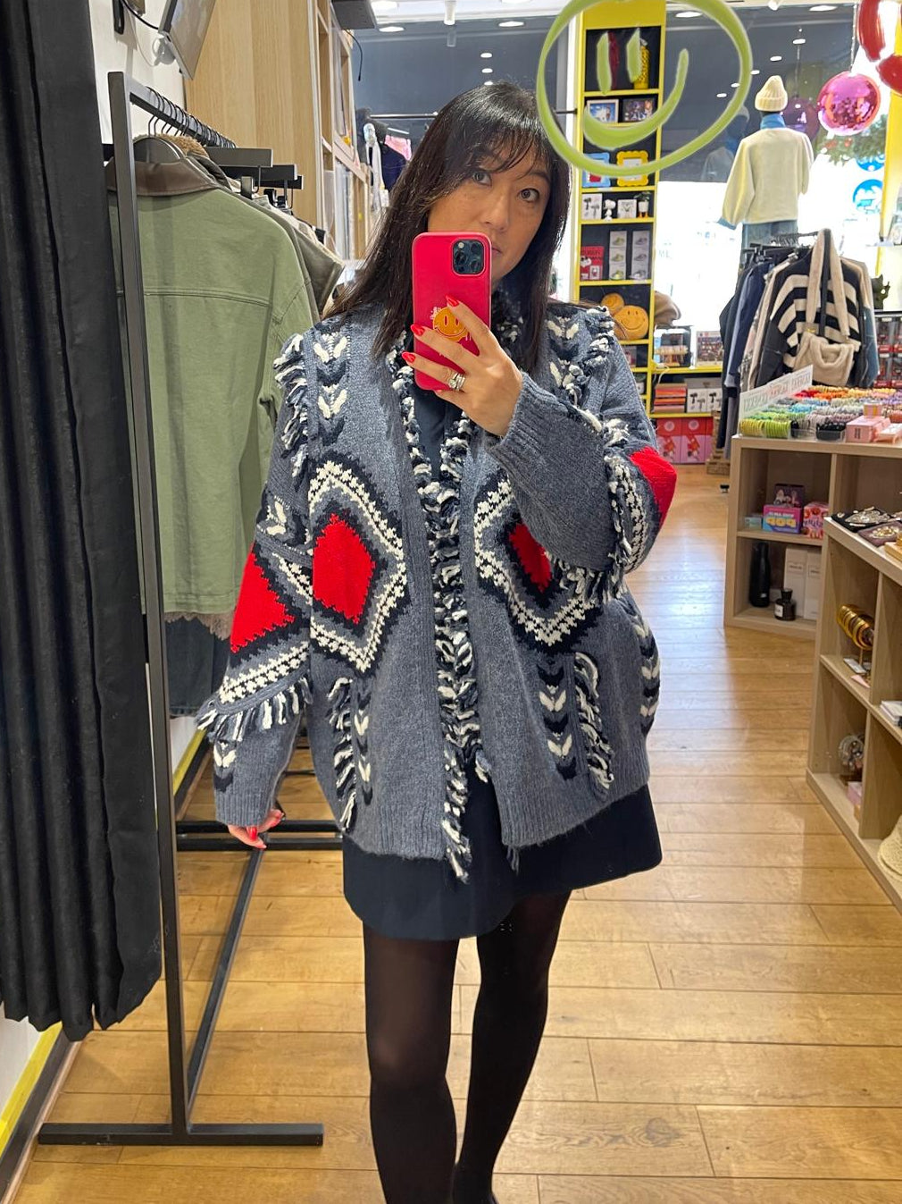 Gilet à franges bleu et rouge à motifs géométriques